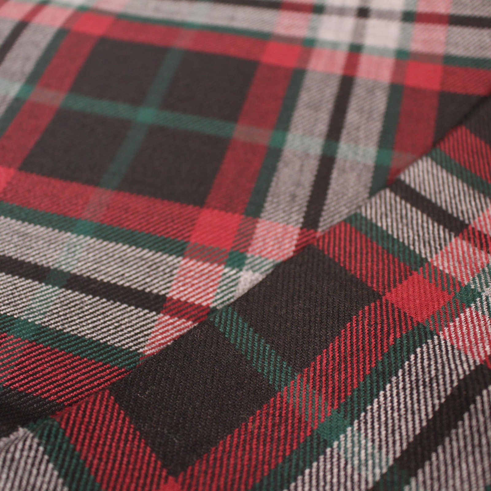Premium red and charcoal plaid flannel fabric with green and white stripes