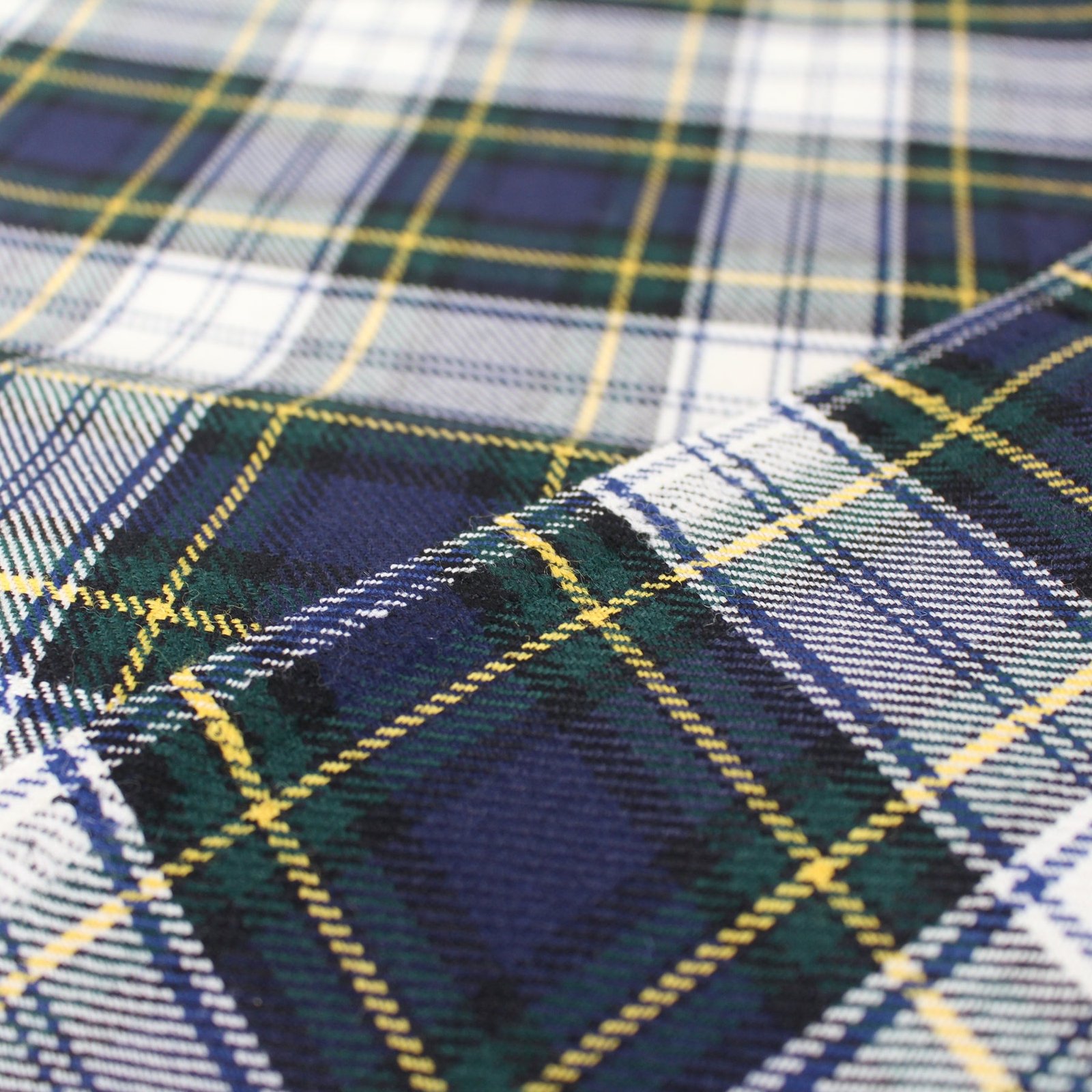 Premium navy and green flannel plaid fabric with yellow and white stripes