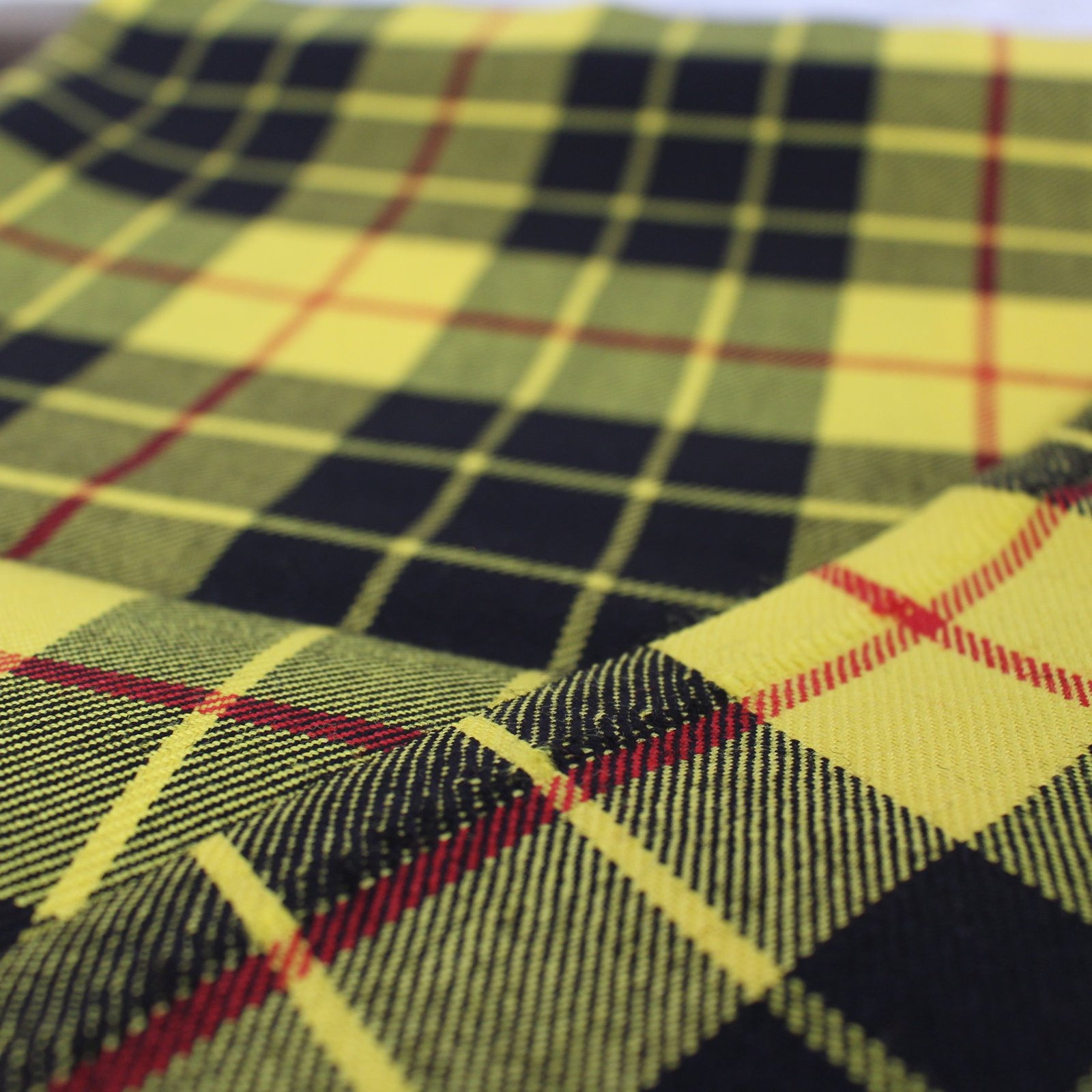 Premium yarn dyed textiles in yellow and black tartan pattern