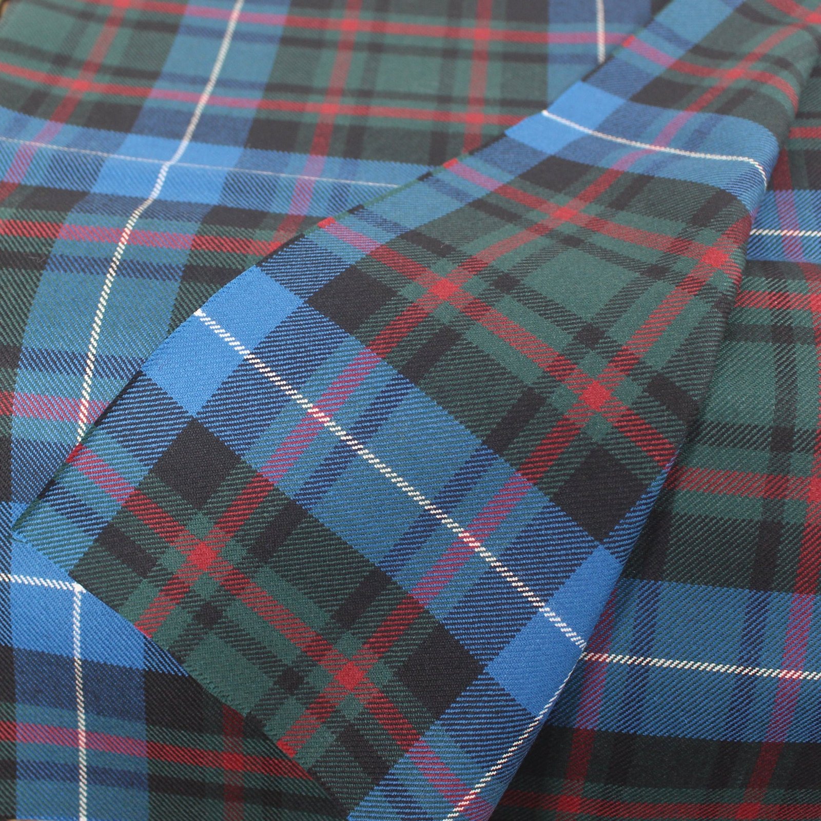 Professional textile sourcing Pakistan: blue and green tartan flannel