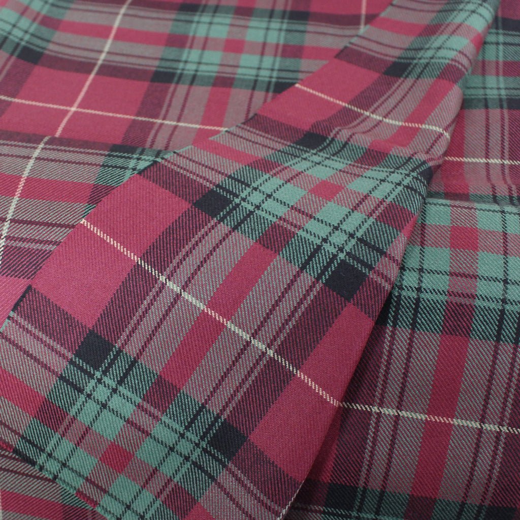 Tartan bedding material in maroon and sage green