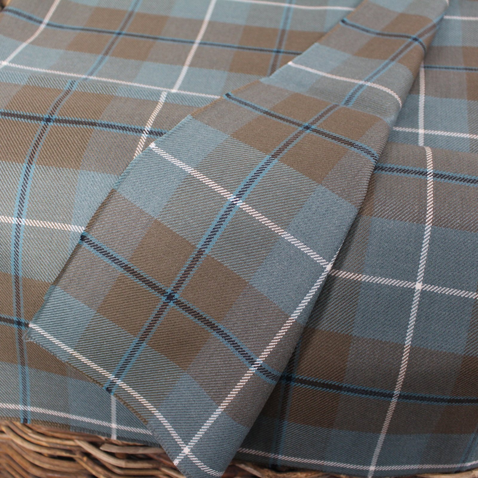 Premium yarn dyed textiles in slate blue and taupe tartan pattern
