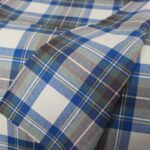 Tejido de franela de calidad de exportación con motivos de tartán azul cobalto y marrón