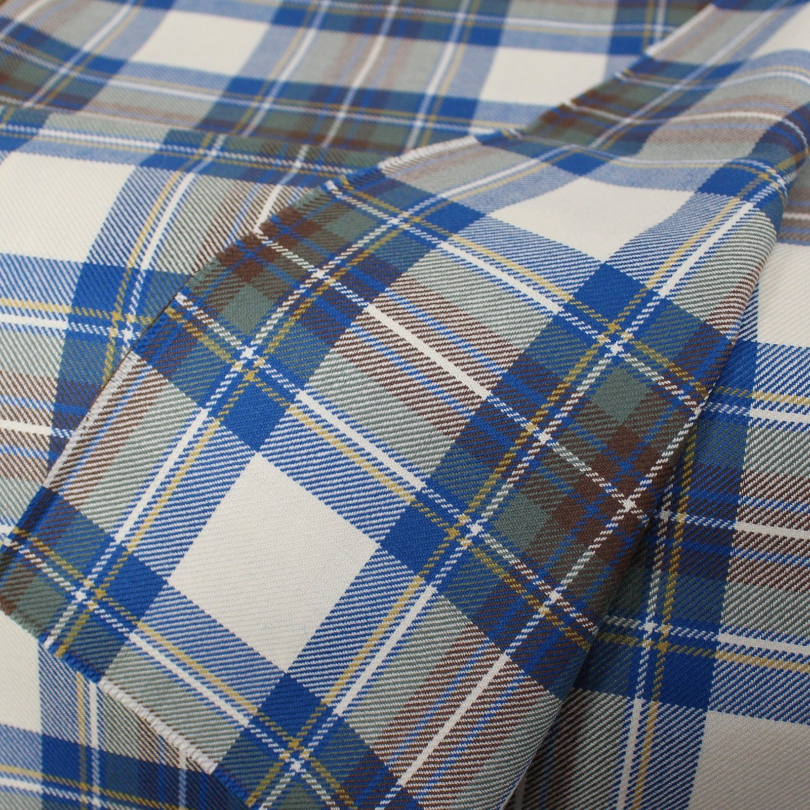 Export quality flannel fabric in cobalt blue and brown tartan pattern