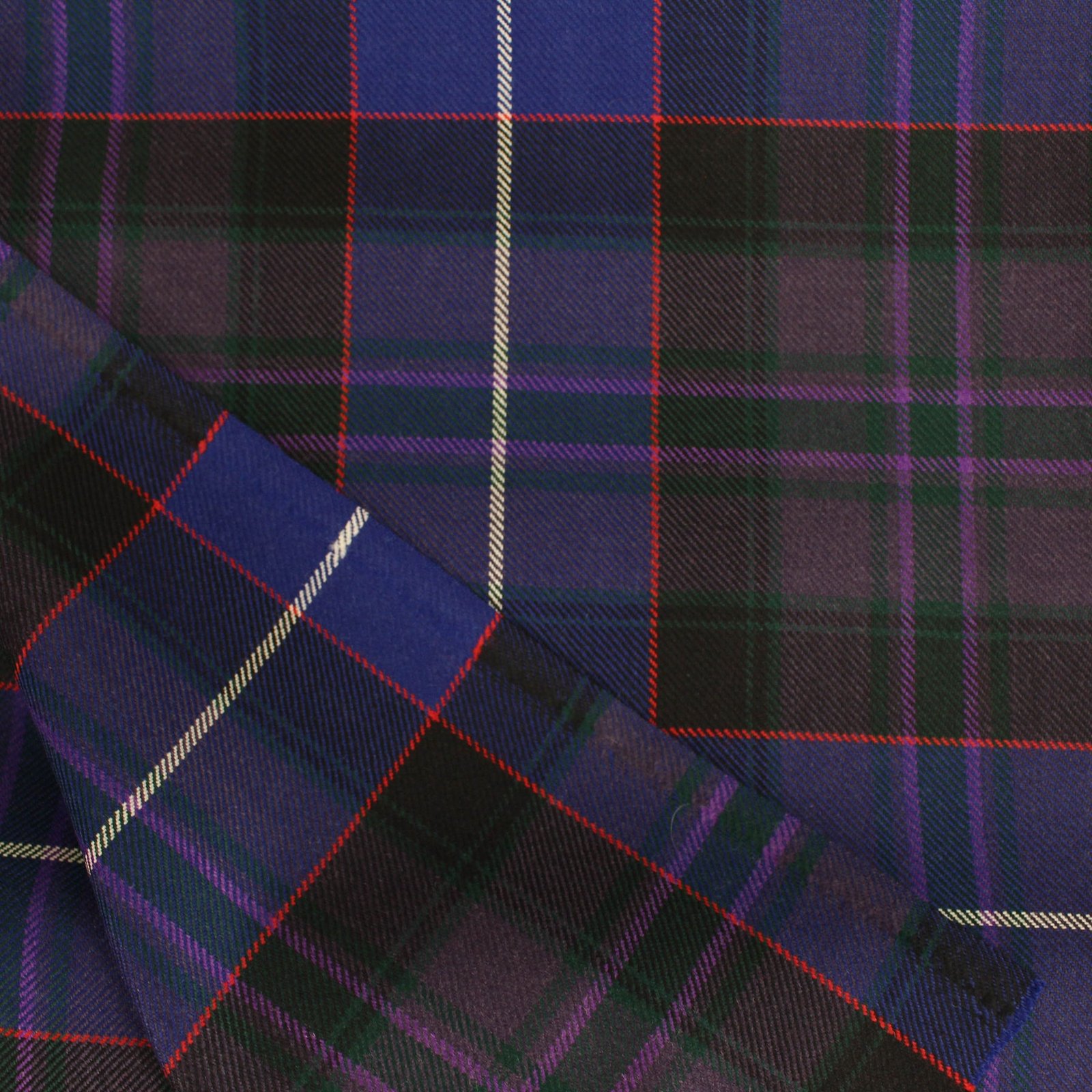 Bulk cotton flannel fabric in deep purple and cobalt blue tartan pattern
