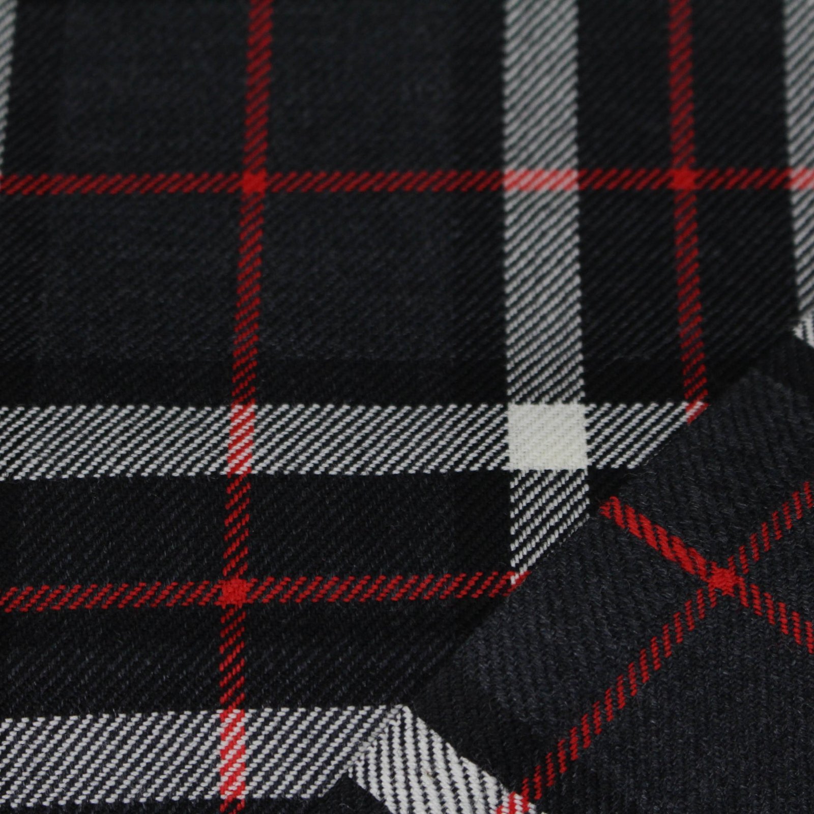 Premium charcoal plaid flannel fabric with white and red stripes