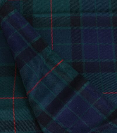 Close up view of soft navy and green cotton flannel plaid fabric with red overcheck