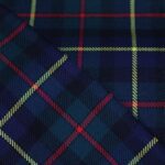 Premium navy and green yarn dyed flannel bedding fabric with yellow and red stripes