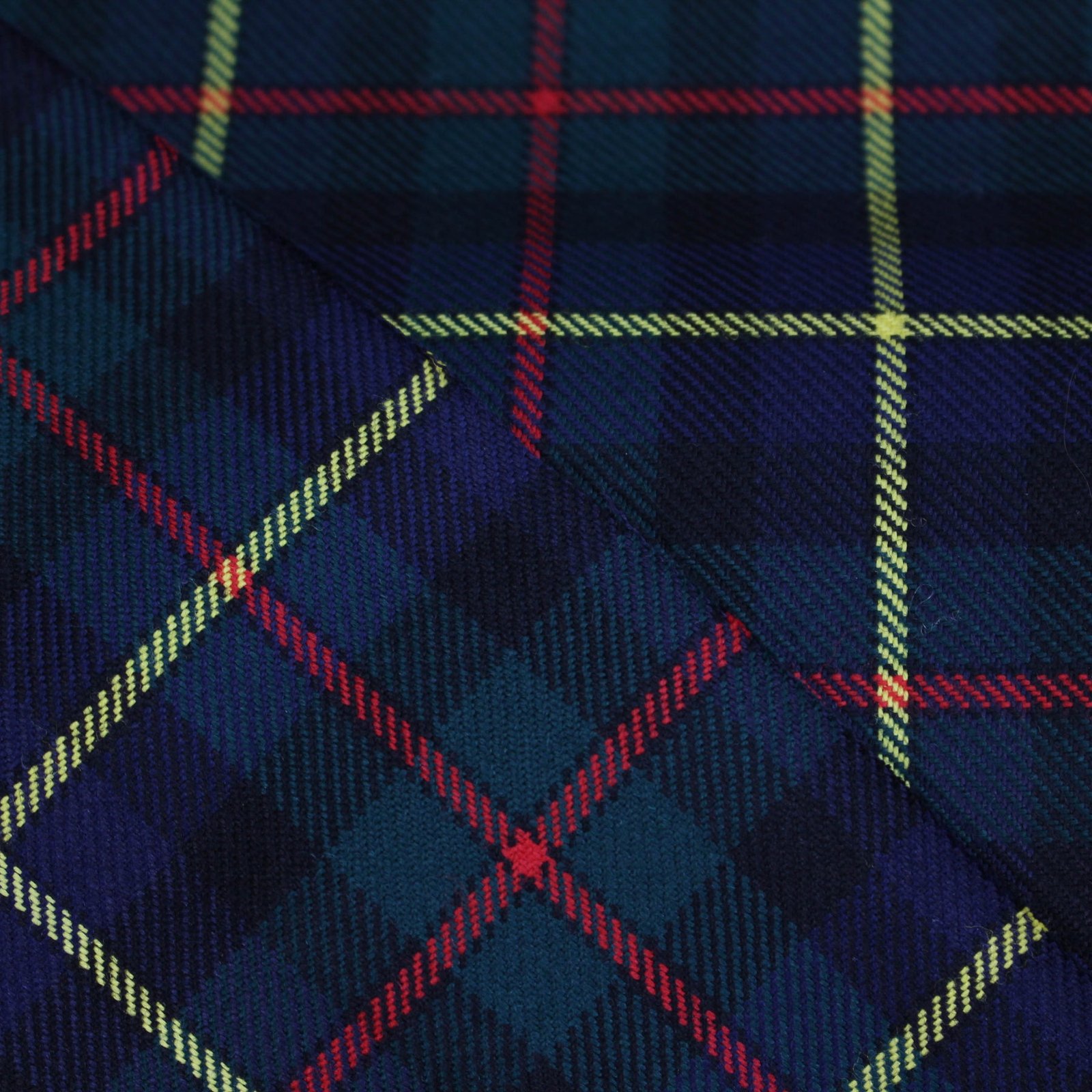 Premium navy and green yarn dyed flannel bedding fabric with yellow and red stripes